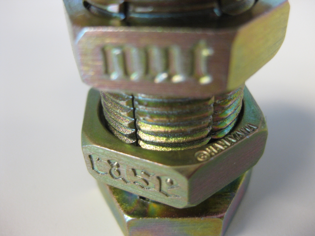 Closeup of the engraving on the nuts